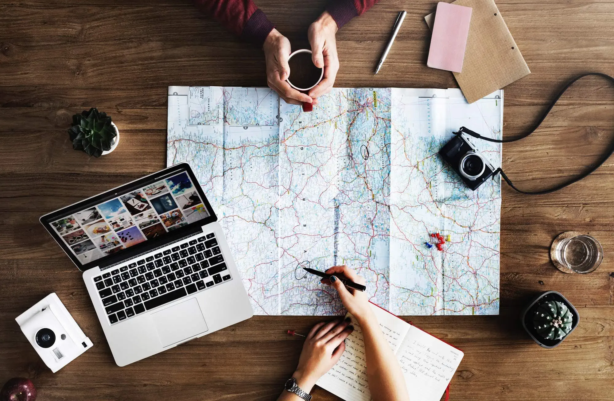 shows two people looking at a map planning a trip.